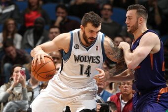 MINNEAPOLIS, MN - JANUARY 8: Nikola Pekovic #14 of the Minnesota Timberwolves drives against the Phoenix Suns on January 8, 2014 at Target Center in Minneapolis, Minnesota. NOTE TO USER: User expressly acknowledges and agrees that, by downloading and or u