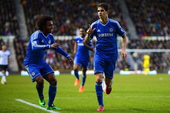 DERBY, ENGLAND - JANUARY 05:  Willian of Chelsea (L) congratulates Oscar of Chelsea on scoring their second goal during the Budweiser FA Cup Third Round match between Derby County and Chelsea at iPro Stadium on January 5, 2014 in Derby, England.  (Photo b