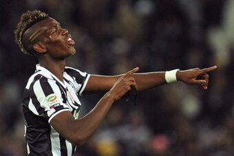 TURIN, ITALY - NOVEMBER 10:  Paul Pogba of Juventus celebrates victory at the end of the Serie A match between Juventus and SSC Napoli at Juventus Arena on November 10, 2013 in Turin, Italy.  (Photo by Valerio Pennicino/Getty Images)