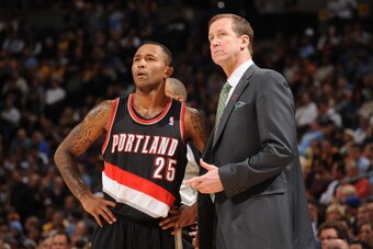 DENVER, CO - NOVEMBER 1: Terry Stotts, Head Coach of the Portland Trail Blazers shares a word with Mo Williams #25 during the game against the Denver Nuggets on November 1, 2013 at the Pepsi Center in Denver, Colorado. NOTE TO USER: User expressly acknowl