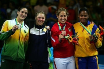 RIO DE JANEIRO, BRAZIL - JULY 20:  (L-R) Mayra Silva of Brazil (silver), Ronda Rousey of the United States of America (gold), Catherine Roberge (bronze), Yuri Alver Colombia (bronze) pose with medals after the Women's 70Kg Judo final in the 2007 XV Pan Am