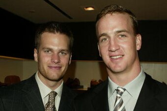 NEW YORK - APRIL13:  (L-R) NFL Quarterbacks Tom Brady and Peyton Manning attend the Ermenegildo Zegna Flagship store opening April 13, 2004 in New York City.  (Photo by Peter Kramer/Getty Images)