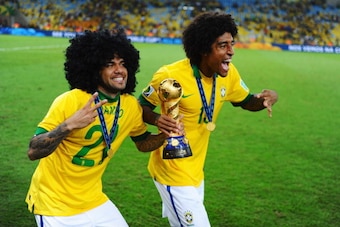 RIO DE JANEIRO, BRAZIL - JUNE 30:  Dante (R) and Daniel Alves of Brazil celebrate after victory in the FIFA Confederations Cup Brazil 2013 Final match between Brazil and Spain at Maracana on June 30, 2013 in Rio de Janeiro, Brazil.  (Photo by Laurence Gri