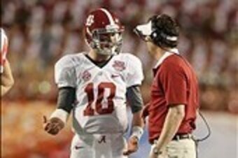 Jan 7, 2013; Miami, FL, USA; Alabama Crimson Tide quarterback A.J. McCarron (10) talks with quarterbacks coach Doug Nussmeier during a timeout against the Notre Dame Fighting Irish during the 2013 BCS Championship game at Sun Life Stadium. Alabama won 42-