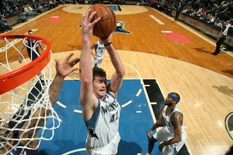 MINNEAPOLIS, MN - JANUARY 8: Kevin Love #42 of the Minnesota Timberwolves rebounds against the Phoenix Suns on January 8, 2014 at Target Center in Minneapolis, Minnesota. NOTE TO USER: User expressly acknowledges and agrees that, by downloading and or usi