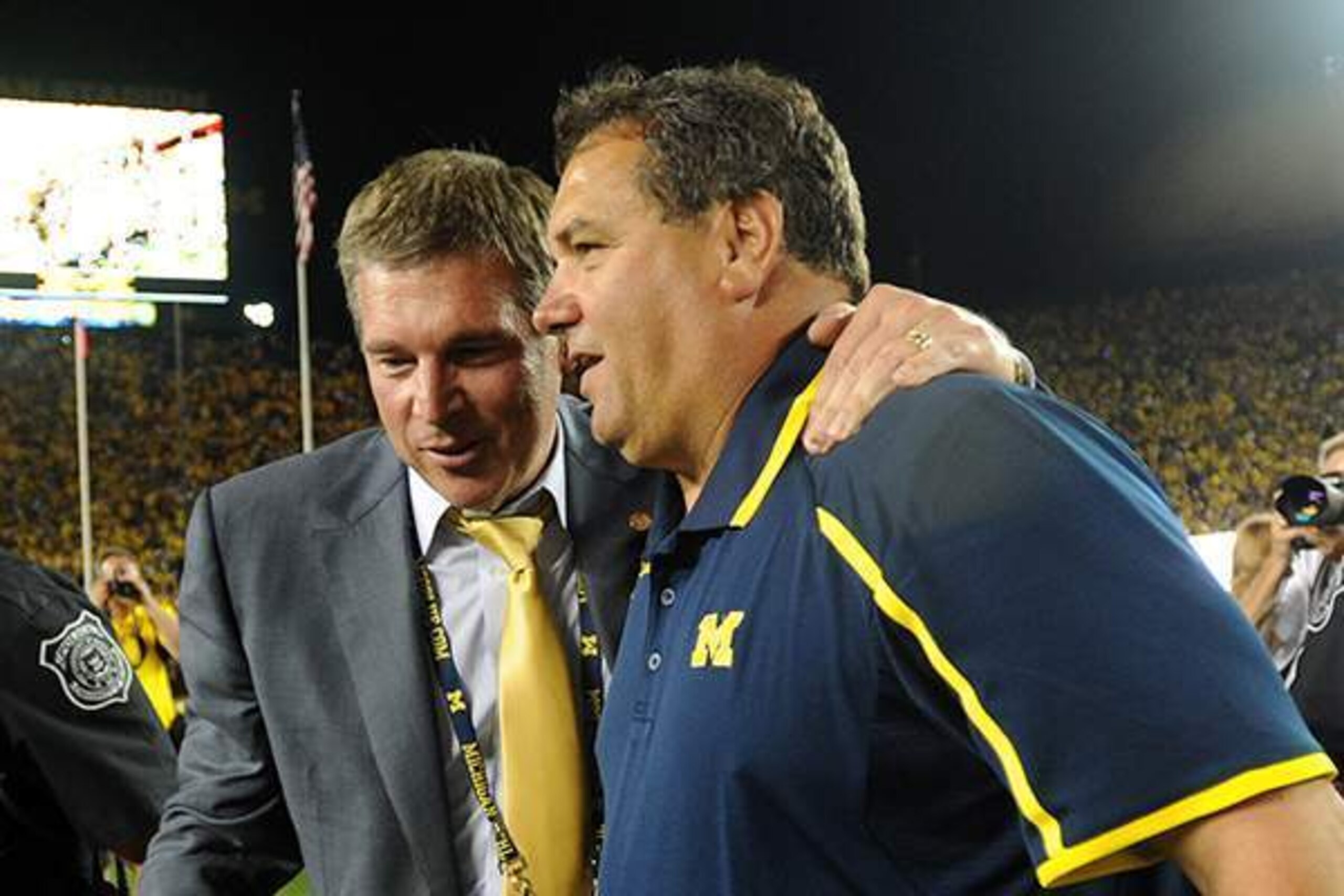 Dave Brandon and Brady Hoke celebrate Michigan's win over Notre Dame in September.