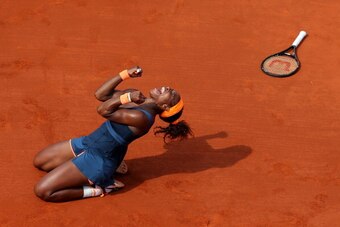 PARIS, FRANCE - JUNE 08:  Serena Williams of United States of America celebrates match point in her Women's Singles Final match against Maria Sharapova of Russia  during day fourteen of French Open at Roland Garros on June 8, 2013 in Paris, France.  (Phot