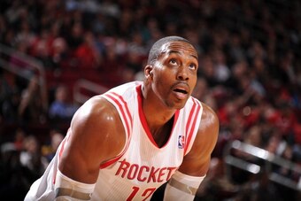 HOUSTON, TX - DECEMBER 26:  Dwight Howard #12 of the Houston Rockets reacts to a play against the Memphis Grizzlies on December 26, 2013 at the Toyota Center in Houston, Texas. NOTE TO USER: User expressly acknowledges and agrees that, by downloading and 