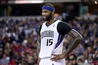 Jan 7, 2014; Sacramento, CA, USA; Sacramento Kings center DeMarcus Cousins (15) smiles as a call is reviewed during the first quarter against the Portland Trail Blazers at Sleep Train Arena. Mandatory Credit: Kelley L Cox-USA TODAY Sports