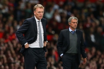 MANCHESTER, ENGLAND - AUGUST 26:  Manchester United Manager David Moyes and Chelsea Manager Jose Mourinho (R) look on during the Barclays Premier League match between Manchester United and Chelsea at Old Trafford on August 26, 2013 in Manchester, England.