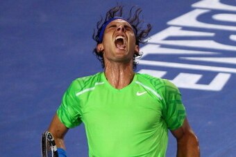 MELBOURNE, AUSTRALIA - JANUARY 29:  Rafael Nadal of Spain celebrates winning set point in his men's final match against Novak Djokovic of Serbia during day fourteen of the 2012 Australian Open at Melbourne Park on January 29, 2012 in Melbourne, Australia.