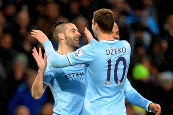 MANCHESTER, ENGLAND - JANUARY 08: Edin Dzeko of Manchester City congratulates Alvaro Negredo of Manchester City on scoring their fourth goal and his hat trick during the Capital One Cup Semi-Final first leg match between Manchester City and West Ham Unite MANCHESTER, ENGLAND - JANUARY 08: Edin Dzeko of Manchester City congratulates Alvaro Negredo of Manchester City on scoring their fourth goal and his hat trick during the Capital One Cup Semi-Final first leg match between Manchester City and West Ham Unite