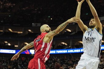 LONDON, ENGLAND - MAY 12:  Nikola Mirotic of Real Madrid tussles with Antic Pero of Olympiacos Piraeus during the Turkish Airlines EuroLeague Final Four final between Olympiacos Piraeus and Real Madrid at the O2 Arena on May 12, 2013 in London, England.  