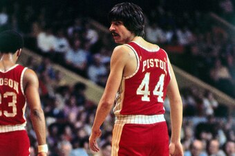 BOSTON - 1973:  Pete Maravich #44 of the Atlanta Hawks walks on the court against the Boston Celtics during a game played in 1973 at the Boston Garden in Boston, Massachusetts. NOTE TO USER: User expressly acknowledges and agrees that, by downloading and