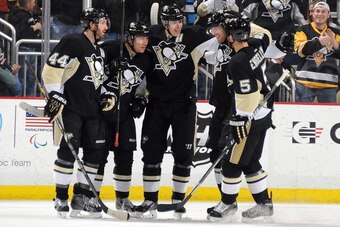 PITTSBURGH, PA - JANUARY 5:  Jussi Jokinen #36 of the Pittsburgh Penguins celebrates his goal with teammates during the second period against the Winnipeg Jets on January 5, 2014 at Consol Energy Center in Pittsburgh, Pennsylvania.  (Photo by Joe Sargent/