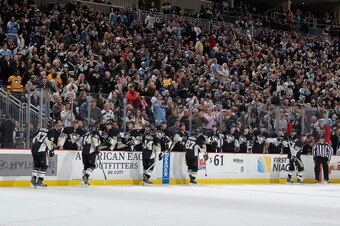 PITTSBURGH, PA - JANUARY 3:  Sidney Crosby #87 of the Pittsburgh Penguins celebrates his goal with the bench during the second period against the New York Rangers on January 3, 2014 at Consol Energy Center in Pittsburgh, Pennsylvania.  (Photo by Gregory S