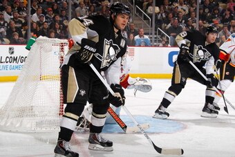 PITTSBURGH, PA - DECEMBER 21:  Chris Kunitz #14 of the Pittsburgh Penguins skates against the Calgary Flames on December 21, 2013 at Consol Energy Center in Pittsburgh, Pennsylvania.  (Photo by Gregory Shamus/NHLI via Getty Images)