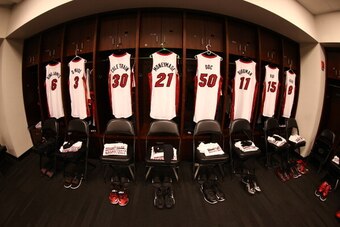 NEW YORK, NY - JANUARY 10:  LeBron James #6, Dwyane Wade #3, Norris Cole #30, Roger Mason Jr. #21, Joel Anthony #50, Chris Andersen #11 and Mario Chalmers #15 of the Miami Heat jerseys hang in their locker prior to a game at the Barclays Center on January