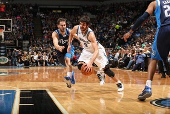 MINNEAPOLIS, MN - DECEMBER 30: Ricky Rubio #9 of the Minnesota Timberwolves drives to the basket against the Dallas Mavericks during the game on December 30, 2013 at Target Center in Minneapolis, Minnesota. NOTE TO USER: User expressly acknowledges and ag