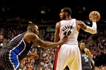 Jan 8, 2014; Portland, OR, USA; Portland Trail Blazers power forward LaMarcus Aldridge (12) posts up Orlando Magic power forward Glen Davis (11) at the Moda Center. Mandatory Credit: Craig Mitchelldyer-USA TODAY Sports