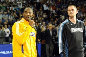 LONDON, ENGLAND - OCTOBER 4:   Kobe Bryant #24 of the Los Angeles Lakers and Kevin Love #42 of the Minnesota Timberwolves talk to the crowd at The O2 arena on October 4, 2010 in London, England. NOTE TO USER: User expressly acknowledges and agrees that, b