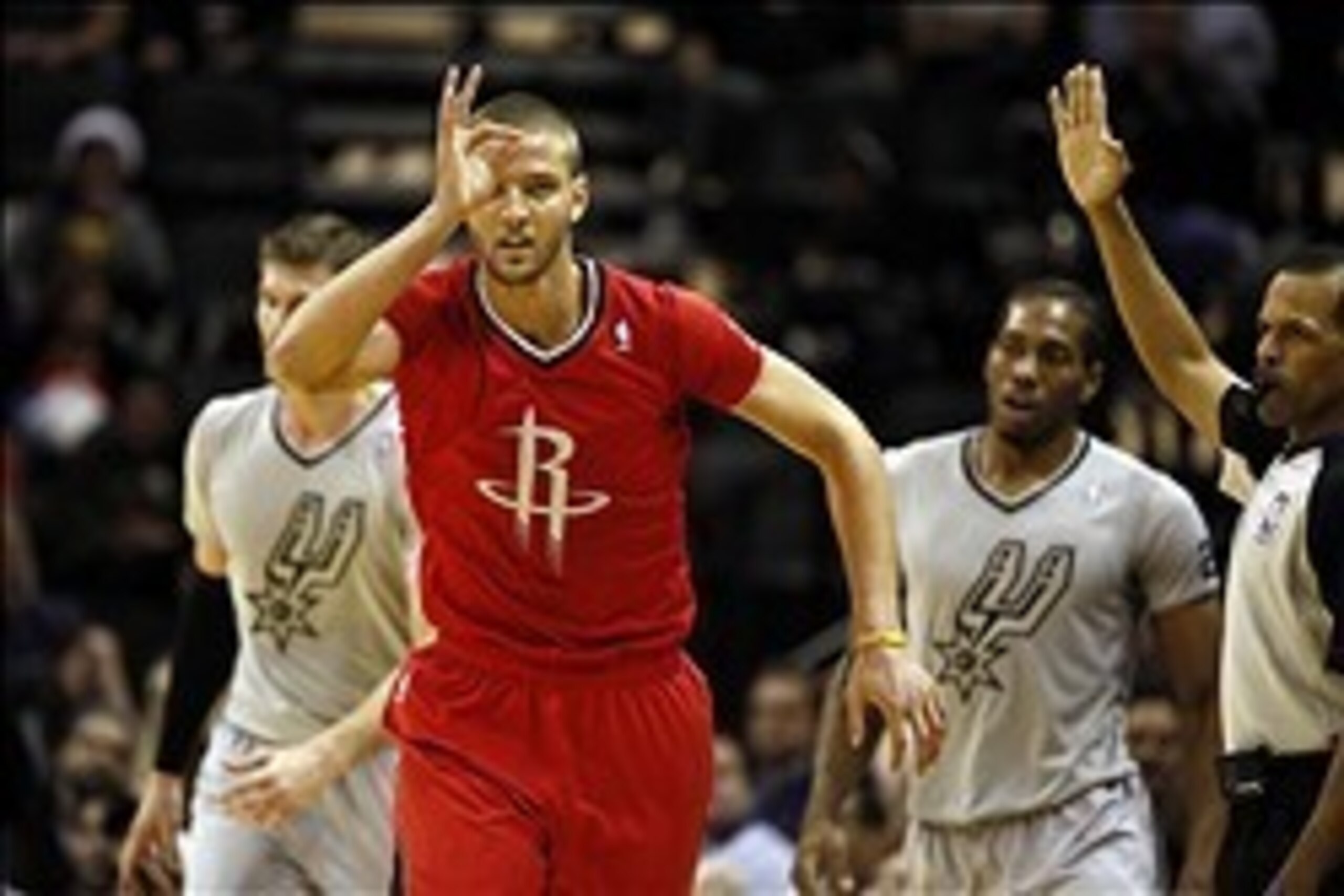 Dec 25, 2013; San Antonio, TX, USA; Houston Rockets forward Chandler Parsons (25) reacts after a shot during the first half against the San Antonio Spurs at AT&T Center. Mandatory Credit: Soobum Im-USA TODAY Sports