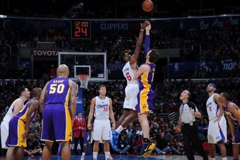LOS ANGELES, CA - JANUARY 10: DeAndre Jordan #6 of the Los Angeles Clippers and Pau Gasol #16 of the Los Angeles Lakers jump for the opening tip at STAPLES Center on January 10, 2014 in Los Angeles, California. NOTE TO USER: User expressly acknowledges an LOS ANGELES, CA - JANUARY 10: DeAndre Jordan #6 of the Los Angeles Clippers and Pau Gasol #16 of the Los Angeles Lakers jump for the opening tip at STAPLES Center on January 10, 2014 in Los Angeles, California. NOTE TO USER: User expressly acknowledges an