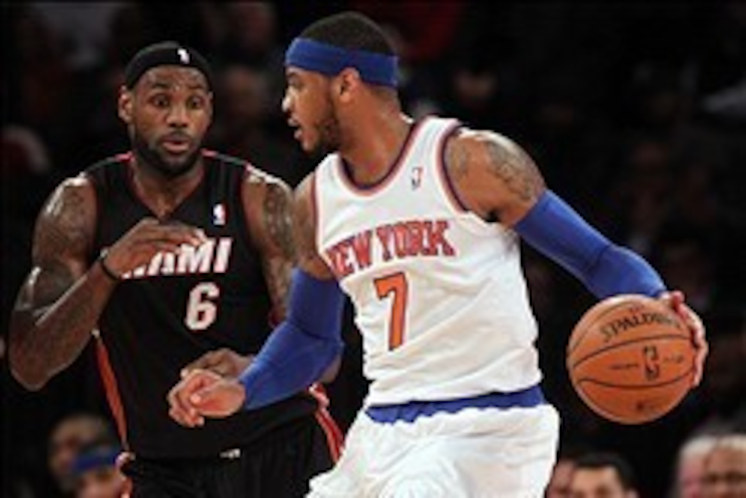Jan 9, 2014; New York, NY, USA; New York Knicks small forward Carmelo Anthony (7) controls the ball against Miami Heat small forward LeBron James (6) during the first quarter of a game at Madison Square Garden. Mandatory Credit: Brad Penner-USA TODAY Spor