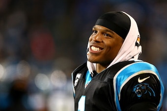 CHARLOTTE, NC - DECEMBER 15:  Cam Newton #1 of the Carolina Panthers reacts on the bench during their game against the New York Jets at Bank of America Stadium on December 15, 2013 in Charlotte, North Carolina.  (Photo by Streeter Lecka/Getty Images)