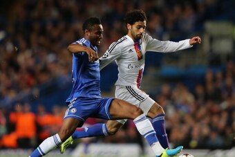 LONDON, ENGLAND - SEPTEMBER 18:  John Obi Mikel of Chelsea and Mohamed Salah of FC Basel battle for the ball  during the UEFA Champions League Group E Match between Chelsea and FC Basel at Stamford Bridge on September 18, 2013 in London, England.  (Photo