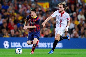 BARCELONA, SPAIN - SEPTEMBER 14:  Lionel Messi of FC Barcelona duels for the ball with Ivan Rakitic of Sevilla FC during the La Liga match between FC Barcelona and Sevilla FC at Camp Nou on September 14, 2013 in Barcelona, Spain.  (Photo by David Ramos/Ge