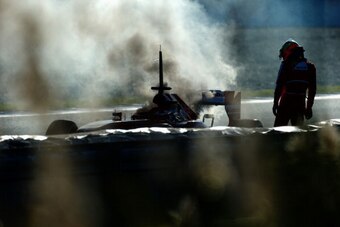 JEREZ DE LA FRONTERA, SPAIN - FEBRUARY 08:  Pedro de la Rosa of Spain and Ferrari examines his car after an engine failure during Formula One winter testing at Circuito de Jerez on February 8, 2013 in Jerez de la Frontera, Spain.  (Photo by Paul Gilham/Ge
