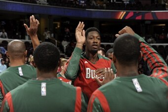 CLEVELAND, OH - OCTOBER 8:  Larry Sanders #8 of the Milwaukee Bucks runs out before the game against the Cleveland Cavaliers at The Quicken Loans Arena on October 8, 2013 in Cleveland, Ohio. NOTE TO USER: User expressly acknowledges and agrees that, by do