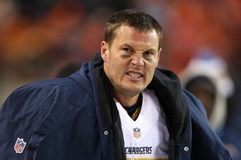 DENVER, CO - JANUARY 12:  Philip Rivers #17 of the San Diego Chargers reacts to a call in the fourth quarter against the Denver Broncos during the AFC Divisional Playoff Game at Sports Authority Field at Mile High on January 12, 2014 in Denver, Colorado. 