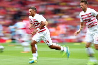 LONDON, ENGLAND - AUGUST 17:  Alex Oxlade-Chamberlain of Arsenal warms up ahead of the Barclays Premier League match between Arsenal and Aston Villa at Emirates Stadium on August 17, 2013 in London, England.  (Photo by Clive Mason/Getty Images)