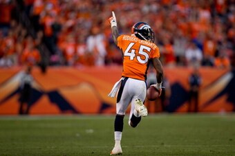 DENVER, CO - OCTOBER 27:  Cornerback Dominique Rodgers-Cromartie #45 of the Denver Broncos strides towards the end zone for a touchdown after making an interception on a pass intended for wide receiver Pierre Garcon #88 of the Washington Redskins during t