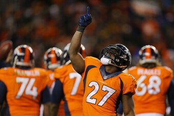DENVER, CO - JANUARY 12:  Knowshon Moreno #27 of the Denver Broncos celebrates his fourth quarter touchdown against the San Diego Chargers during the AFC Divisional Playoff Game at Sports Authority Field at Mile High on January 12, 2014 in Denver, Colorad