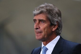 MANCHESTER, ENGLAND - DECEMBER 26: Manuel Pellegrini, manager of Manchester City looks on prior to the Barclays Premier League match between Manchester City and Liverpool at Etihad Stadium on December 26, 2013 in Manchester, England.  (Photo by Alex Lives