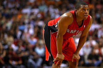 MIAMI, FL - JANUARY 05: Kyle Lowry #7 of the Toronto Raptors looks on during a game against the Miami Heat at AmericanAirlines Arena on January 5, 2014 in Miami, Florida. NOTE TO USER: User expressly acknowledges and agrees that, by downloading and/or usi