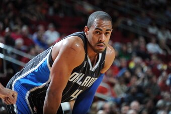 HOUSTON, TX - DECEMBER 8:  Arron Afflalo #4 of the Orlando Magic reacts to a play against the Houston Rockets on December 8, 2013 at the Toyota Center in Houston, Texas. NOTE TO USER: User expressly acknowledges and agrees that, by downloading and or usin