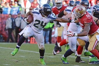 December 8, 2013; San Francisco, CA, USA; Seattle Seahawks running back Marshawn Lynch (24) runs the football against San Francisco 49ers outside linebacker Ahmad Brooks (55) during the third quarter at Candlestick Park. The 49ers defeated the Seahawks 19
