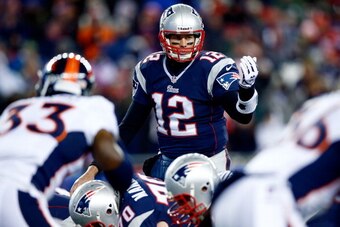 FOXBORO, MA - NOVEMBER 24:  Quarterback Tom Brady #12 of the New England Patriots calls a play against the Denver Broncos during a game at Gillette Stadium on November 24, 2013 in Foxboro, Massachusetts.  (Photo by Jared Wickerham/Getty Images)