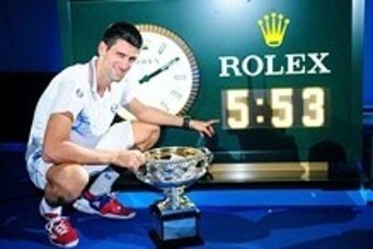 Jan 29, 2012; Melbourne, AUSTRALIA; Novak Djokovic (SRB) poses with the championship trophy after his match against Rafael Nadal (ESP) in the men's singles finals of the 2012 Australian Open at Melbourne Park.  Djokovic won 5-7, 6-4, 6-2, 6-7, 7-5. Mandat