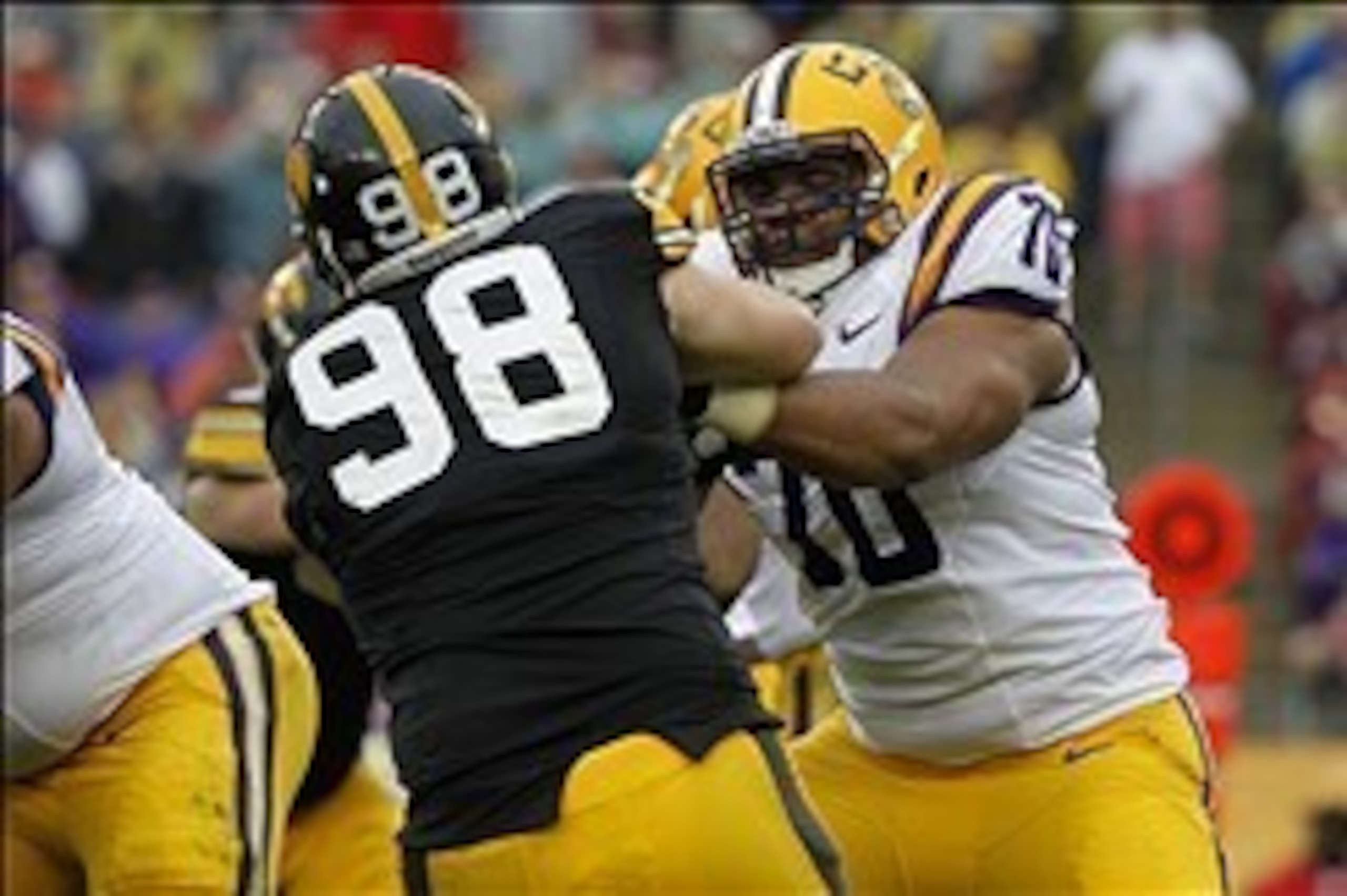 Jan 1, 2014; Tampa, Fl, USA; LSU Tigers offensive tackle La'el Collins (70) blocks as Iowa Hawkeyes defensive lineman Mike Hardy (98) rushes during the first half at Raymond James Stadium. Mandatory Credit: Kim Klement-USA TODAY Sports