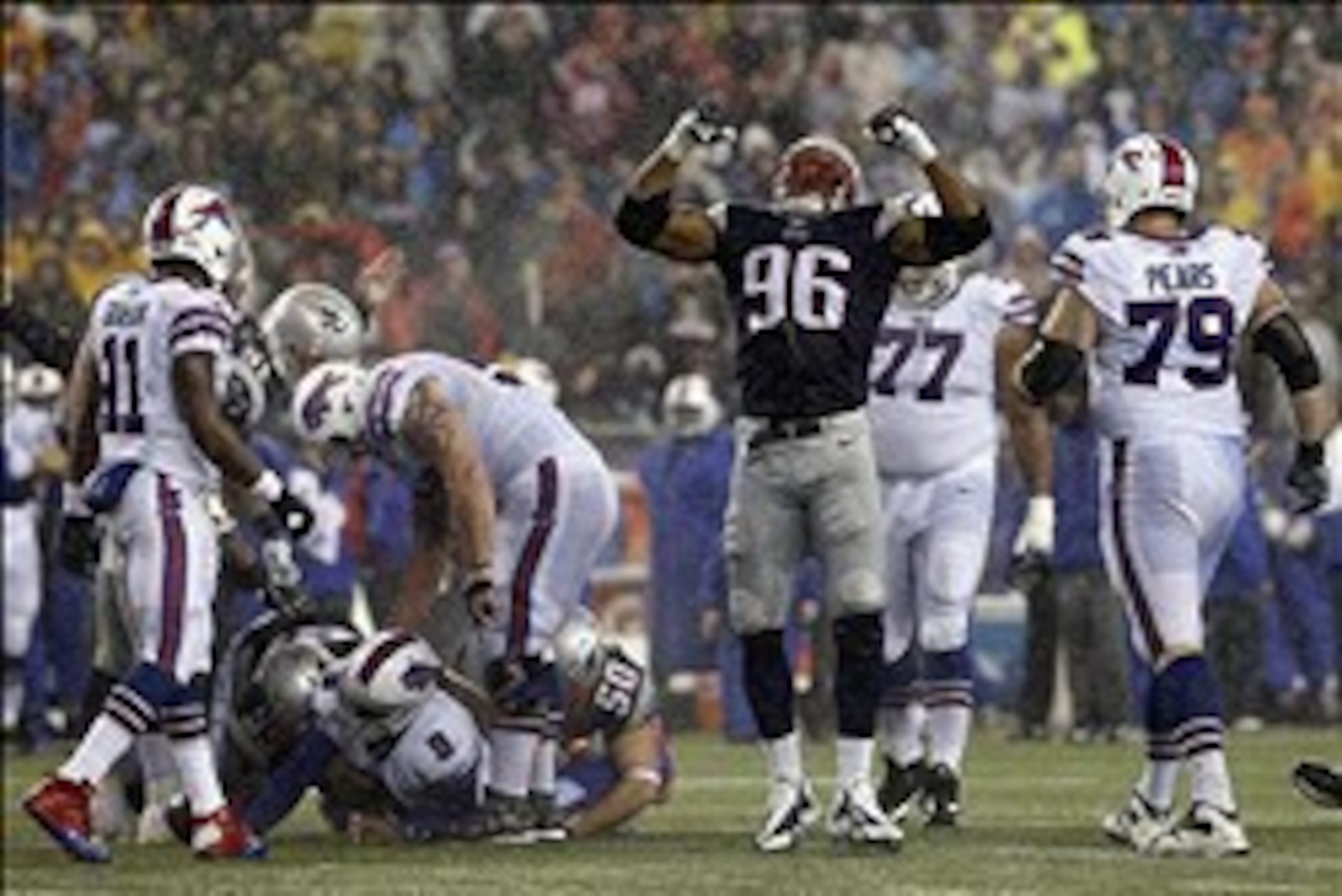 Dec 29, 2013; Foxborough, MA, USA; New England Patriots defensive end Andre Carter (96) reacts after a sack by defensive end Rob Ninkovich (50) against Buffalo Bills quarterback Thad Lewis (9) during the second half at Gillette Stadium. The Patriots defea