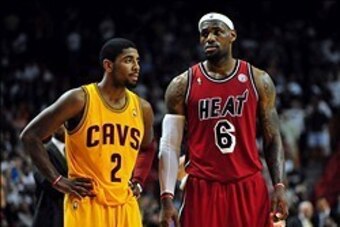 Feb 24, 2013; Miami, FL, USA; Cleveland Cavaliers point guard Kyrie Irving (2) and Miami Heat small forward LeBron James (6) during the second half at the American Airlines Arena.  MIami won 109-105. Mandatory Credit: Steve Mitchell-USA TODAY Sports