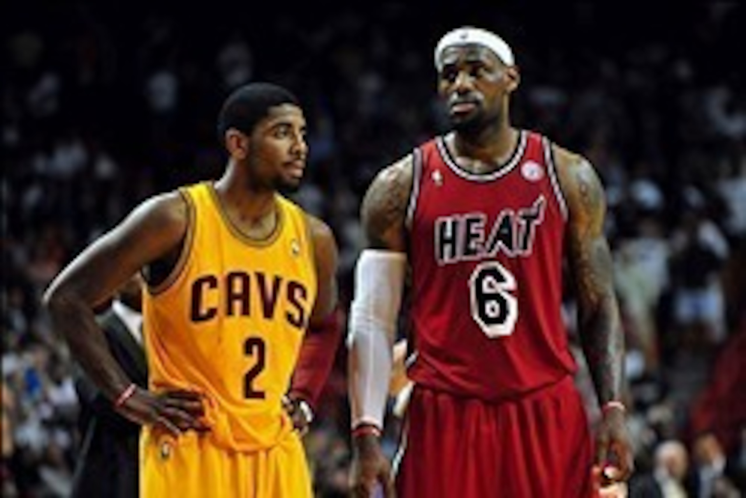 Feb 24, 2013; Miami, FL, USA; Cleveland Cavaliers point guard Kyrie Irving (2) and Miami Heat small forward LeBron James (6) during the second half at the American Airlines Arena.  MIami won 109-105. Mandatory Credit: Steve Mitchell-USA TODAY Sports