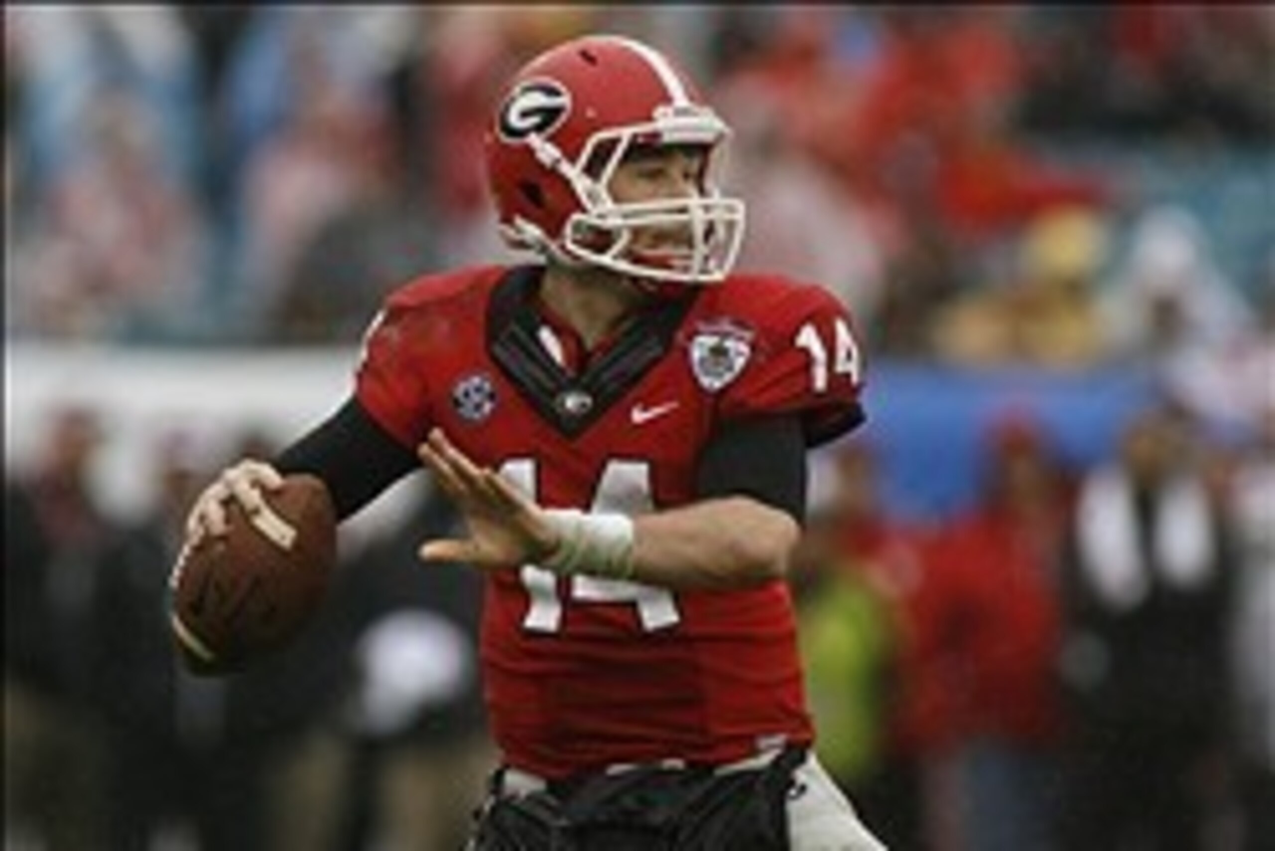 Jan 1, 2014; Jacksonville, FL, USA; Georgia Bulldogs quarterback Hutson Mason (14) throws a pass in the fourth quarter of their game against the Nebraska Cornhuskers at EverBank Field. The Nebraska Cornhuskers beat the Georgia Bulldogs 24-19. Mandatory Cr