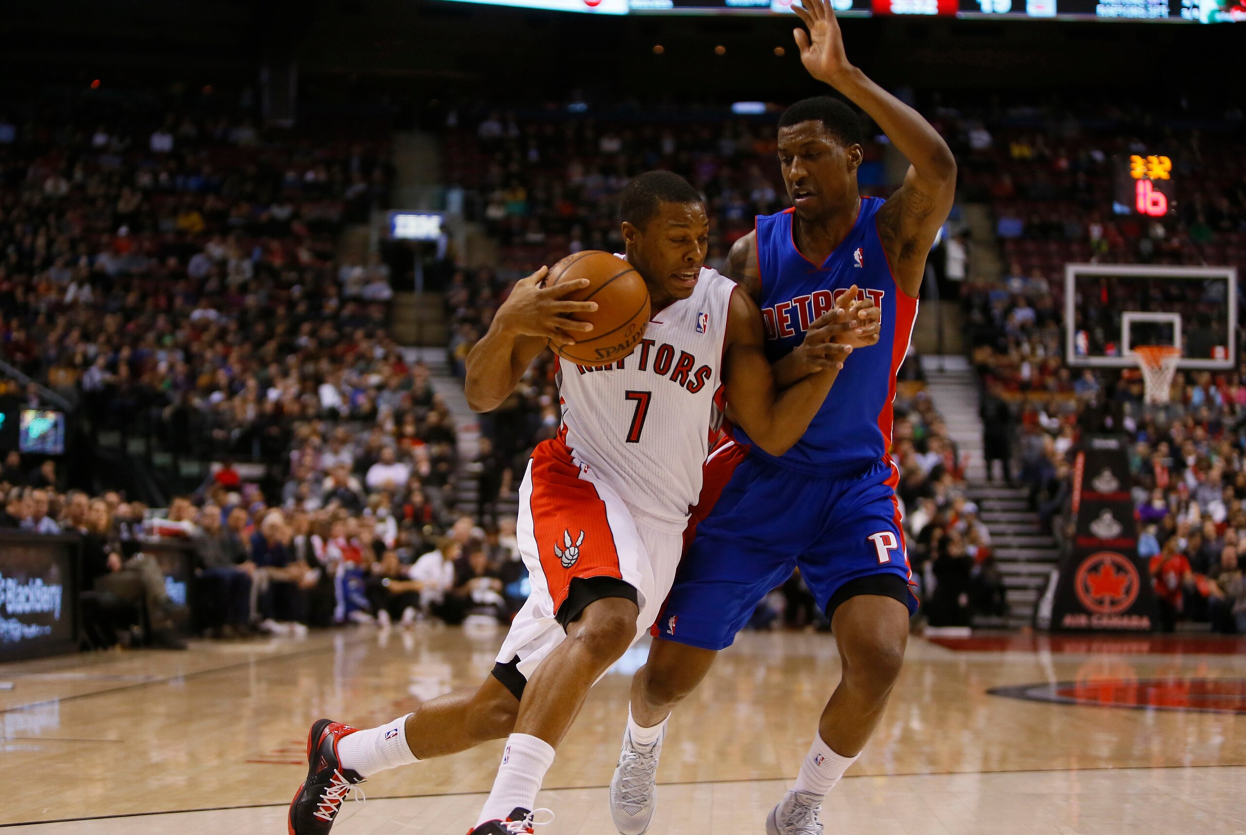 Jan 8, 2014; Toronto, Ontario, CAN; Toronto Raptors guard Kyle Lowry (7) drives to the net against Detroit Pistons guard Kentavious Caldwell-Pope (5) during the first half at the Air Canada Centre. Mandatory Credit: John E. Sokolowski-USA TODAY Sports