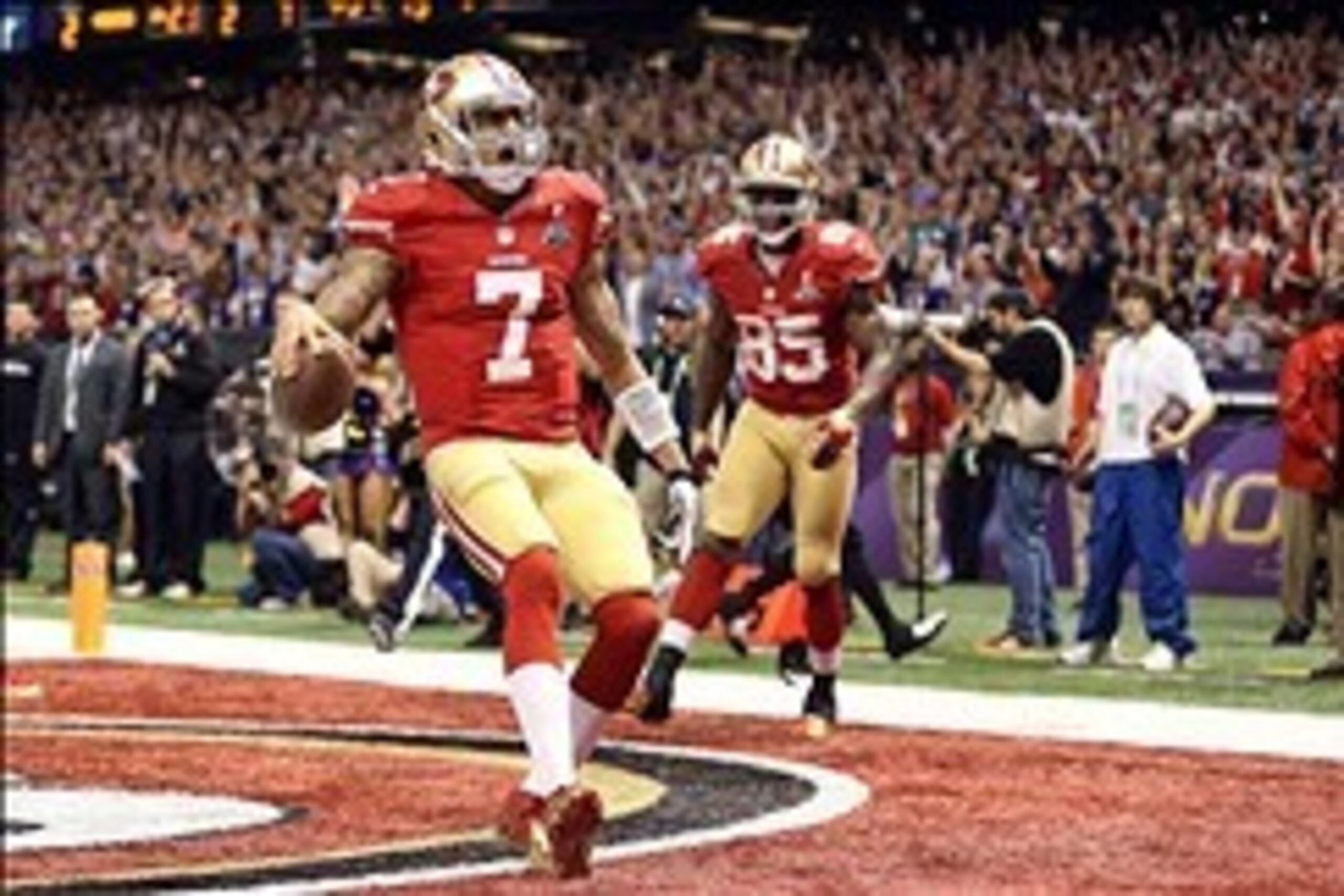 Feb 3, 2013; New Orleans, LA, USA; San Francisco 49ers quarterback Colin Kaepernick (7) scores a touchdown against the Baltimore Ravens in the fourth quarter in Super Bowl XLVII at the Mercedes-Benz Superdome. Mandatory Credit: Mark J. Rebilas-USA TODAY S